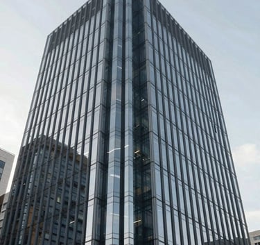 A low-angle shot of a sophisticated glass and steel corporate building against a clear sky. The image reflects modern professionalism and engineering excellence, with a color palette emphasizing #1A202C and #A0AEC0.