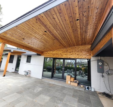 Professional exterior wood staining and soffit finishing for a modern Denver home patio