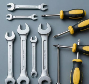An organized tool collection featuring premium wrenches and screwdrivers on a muted blue-grey background, clean top-down view, soft cinematic lighting.
