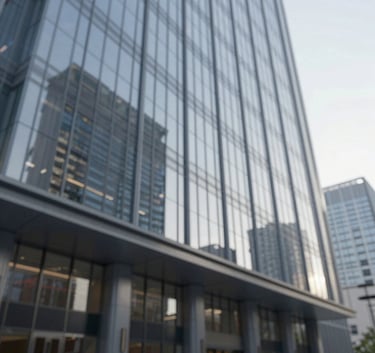 A wide shot of a modern glass skyscraper lobby reflecting a clear sky, exuding professionalism and efficiency with subtle #0B1A2A tones.