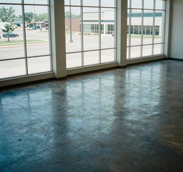 High-angle photography of a spacious, empty commercial building interior in Wichita, polished floors reflecting sky blue light from large windows, North American architecture.