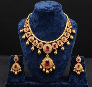 A professional studio shot of high-quality gold-plated imitation jewelry displayed on a velvet Slate Blue stand, highlighting fine Indian craftsmanship for international markets, Global B2B / Indian Origin.