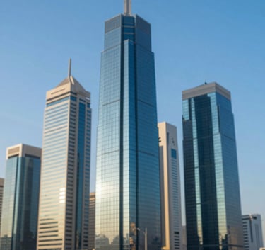 A modern architectural view of a Saudi Arabian business district skyscraper against a clear blue sky, emphasizing professionalism and regional expertise, with reflections of #A1B2BC and #336B87 colors.