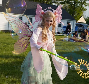Bubble fairy smiling making bubbles