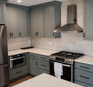a kitchen with a stove top oven and a refrigerator
