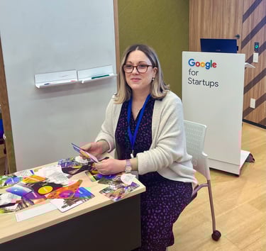 Julie Gachet Mitrovic sitting at a table with Strengths cards for a workshop at Google for Startups