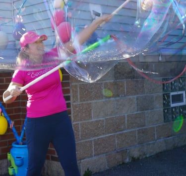 Bubble attendant making bubbles at a party