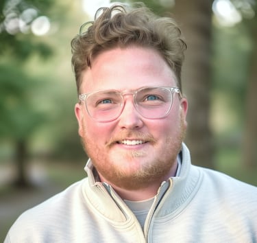 a man with glasses and a white jacket