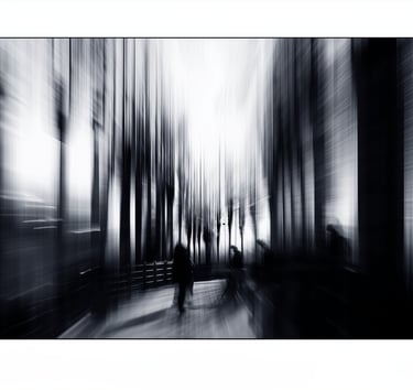 a person walking down a street with a bench and a bench