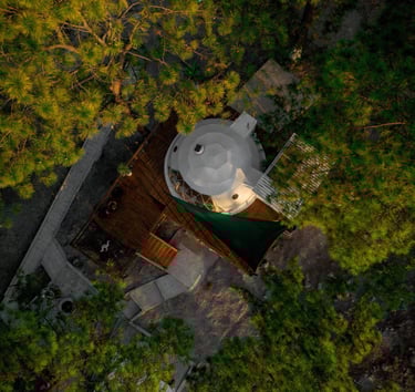 a geo dome with a white top and a white umbrella