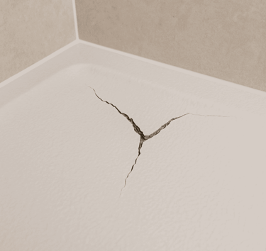 Cracked shower tray in an Auckland bathroom before professional repair by FixShowers