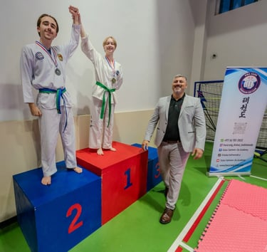 2024 Hwa Rang Tournament Winners on Podium with Master Carlos Bazan