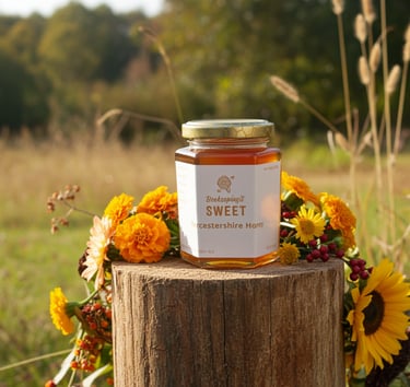 jar of honey in a field
