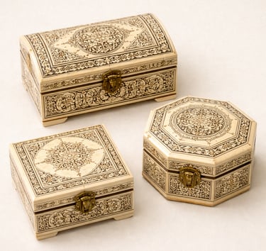 Camel bone jewelry boxes with intricate inlay patterns and carved detailing.