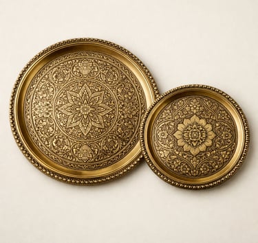 Handcrafted engraved brass serving trays with floral and Mughal motif detailing.