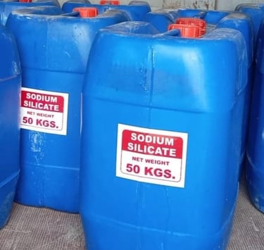 a group of blue plastic barrels with red and white labels filled with liquid sodium silicate