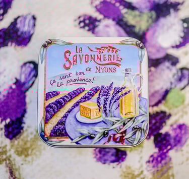 a tin canister with a drawing of lavender flowers