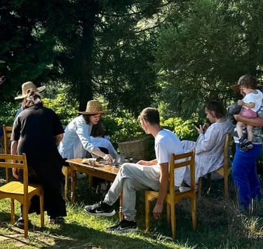 a group of people sitting in the garden have a fun.B&B and Small Hotel Consulting with Timea Pokol