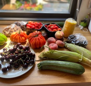 a table with a bunch of fruits and vegetables