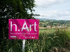 a pink sign that says hArt