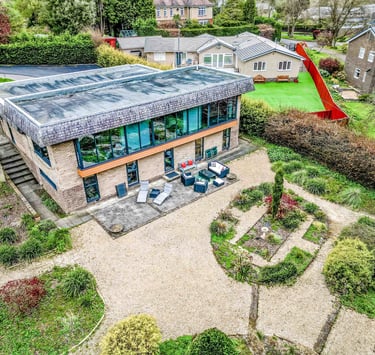 a house with a large garden photographed by a drone