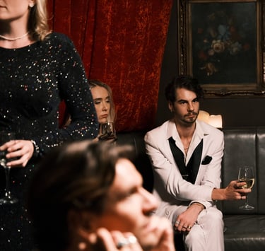 a man and woman sitting on a couch in a room