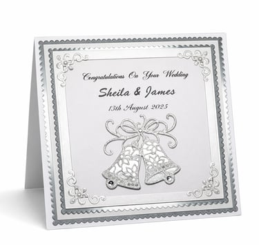 Personalized handmade wedding card featuring silver glitter bells, pearls, and custom names.