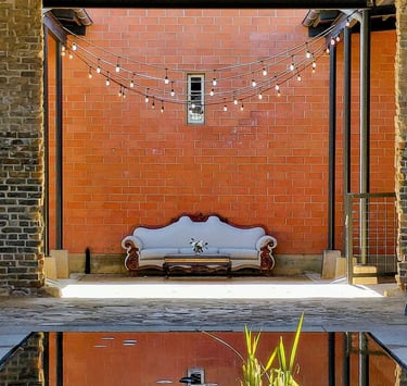 Calm pond with couch visible in the background