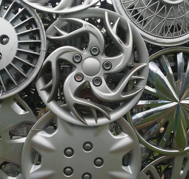 Eight chrome hubcaps welded together.