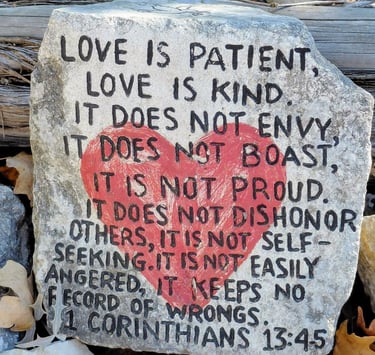 Rock with red heart in center and scripture verse