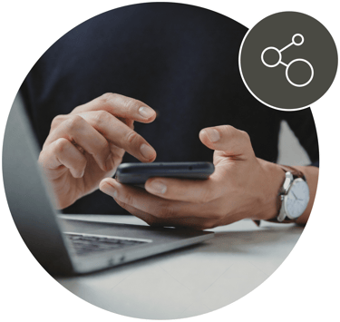 Man holding a phone with icon showing connected
