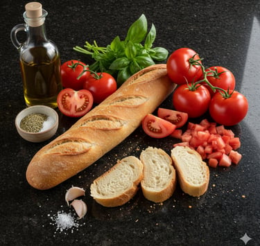 Fresh ingredients for tomato bruschetta with a French baguette, olive oil, basil, and garlic.