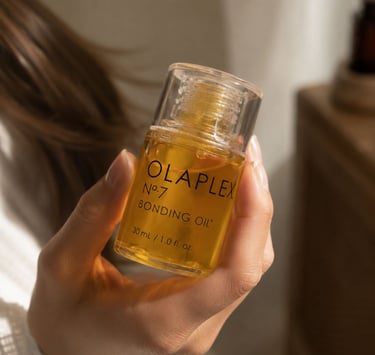 Clean girl aesthetic hair care flatlay with Olaplex bonding oil