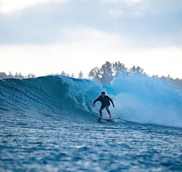 a man riding a wave in the ocean