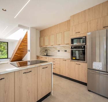 a kitchen with a stainless steel refrigerator and a stainless steel refrigerator