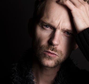 Man looking sad and in pain.