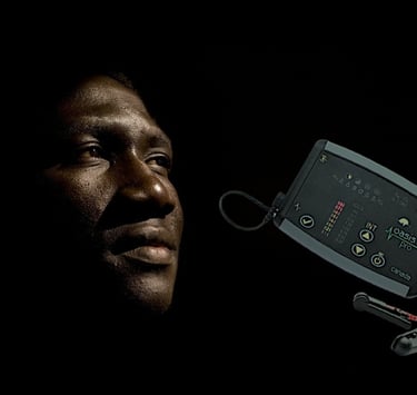 Man in the dark, with a CES machine next to him.