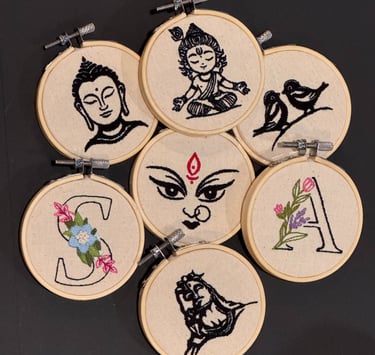 a group of embroidery work embroidered on a wooden hoops - stitching hoop - stitch