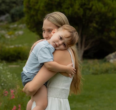 Mother holding her son in the park