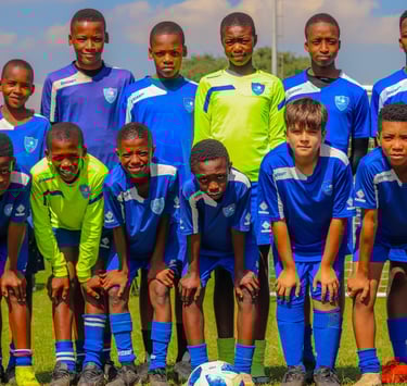 a group of young boys are posing for a picture