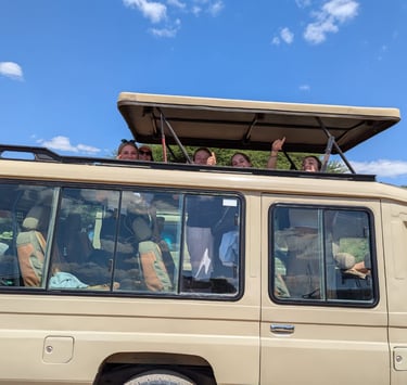 Tourists exploring Tarangire National Park in a safari vehicle on a Tanzania wildlife tour.
