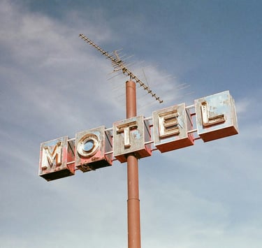 Neon motel sign next the road. Best practices for operational efficiency in hotels with Timea Pokol