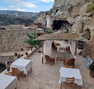 restaurant terrace with a gazeboar and tables. Market Positioning for Tourism with Timea Pokol