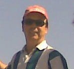 a man in a red hat and a blue shirt