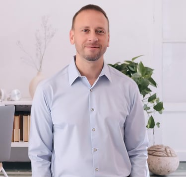 a man in a blue shirt and a laptop