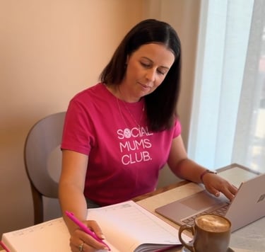 Content creator planning digital marketing and workshop notes while working at a laptop