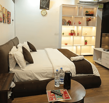 Premium Room at Hotel Kuber Murthal offering stylish interiors and cozy ambiance.