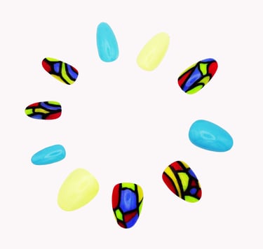Handcrafted abstract press-on nails with azure blue, creamy yellow, red, green, and black on white by Sharp Talons