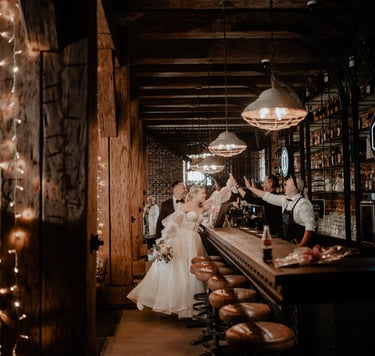a bride and groomsmen are standing in a bar