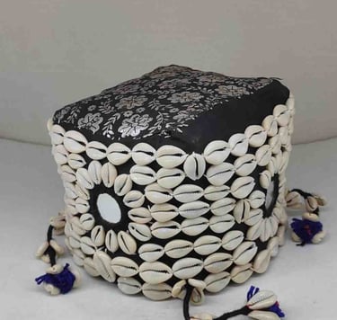 "Black bamboo basket wrapped in cotton fabric with tribal-style shell accents and floral garland-Suitable for export"